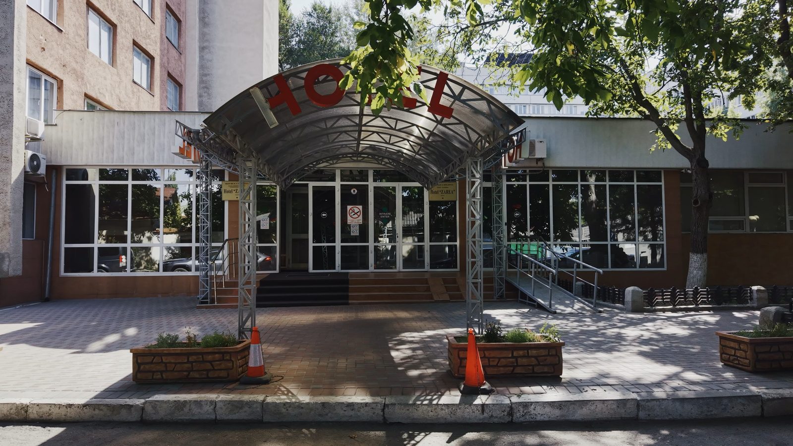 The existing Hotel Zarea entrance, front view from the September 2026 drone survey