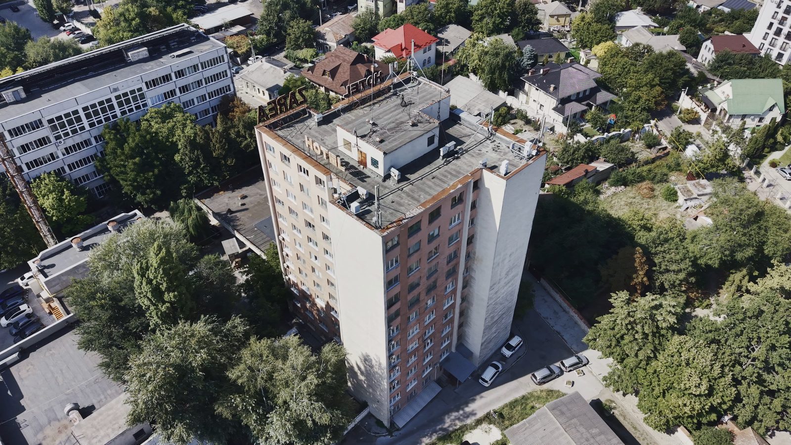 The existing Hotel Zarea tower and roof, original aerial footage from September 2026